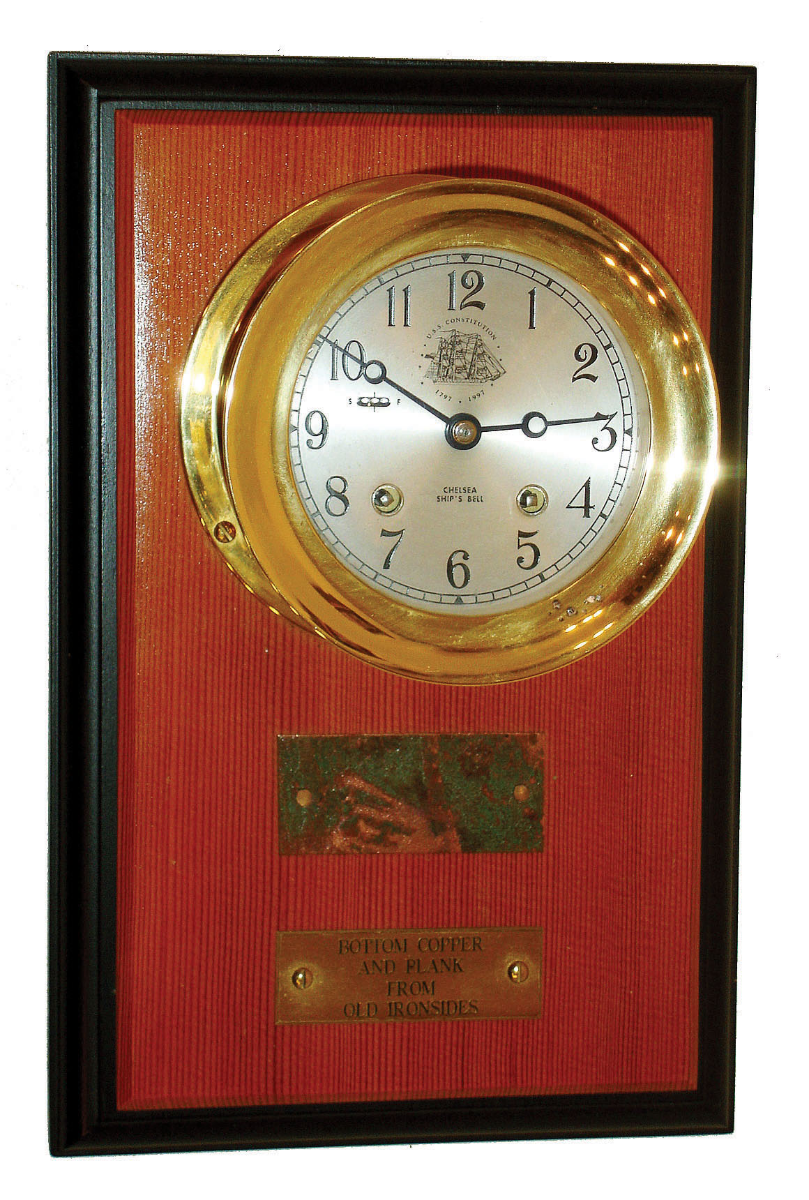 Chelsea Clock Co., Boston, "USS Constitution Commemorative" 8 day 4" dial ship's bells clock on wood display board, hinged bezel, c1999 — Antique Clocks Price Guide