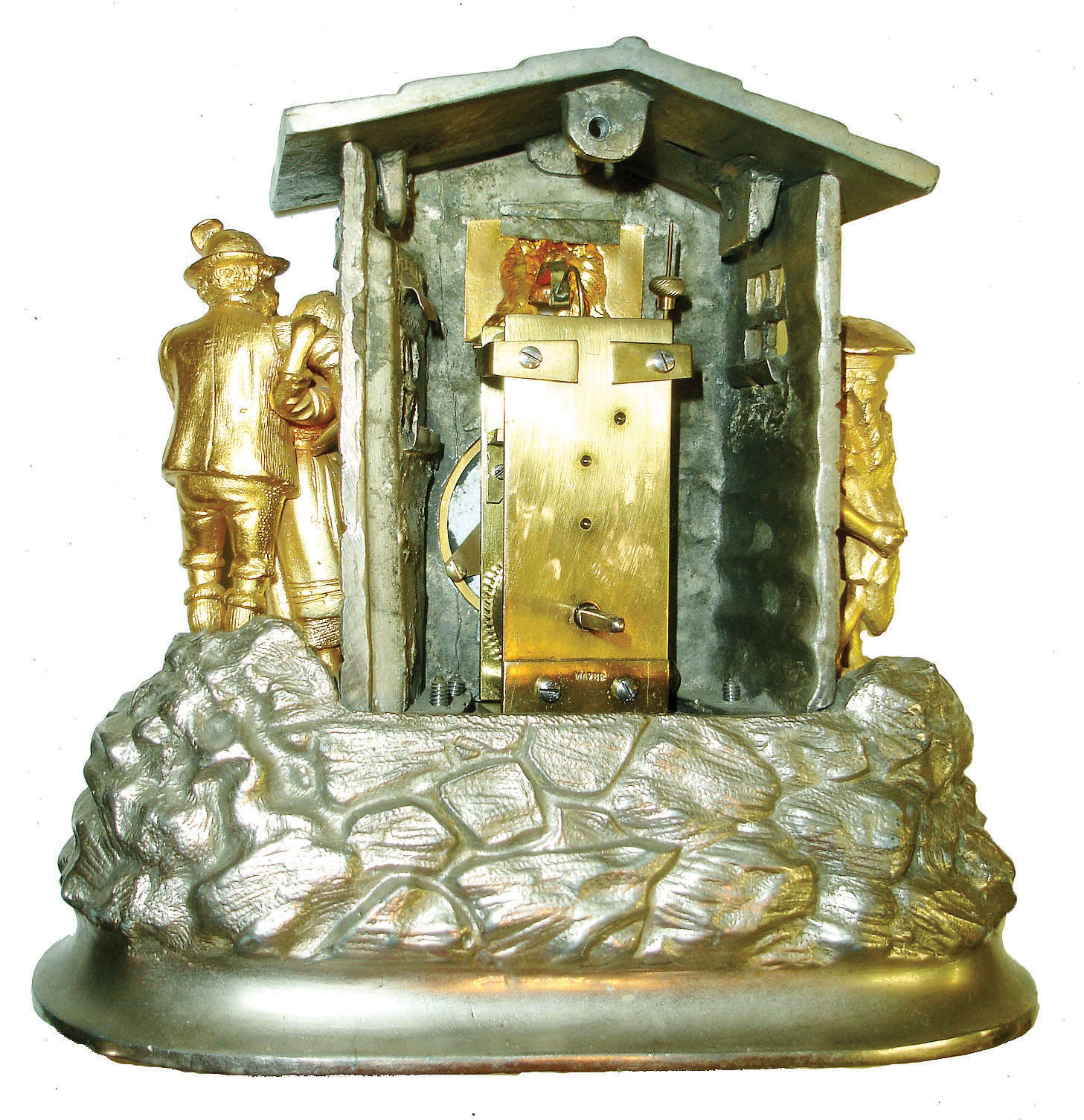Mayer, Germany, 30 hours, novelty clock in a nickeled, cast case, the oval base with rocks and foliage, with a log cabin above, a gnome on the left is preparing to kill a chicken, while on the right side, a woman and man embrace, the white enamel Roman numeral dial, gilt hands, and a panting dog emerging from a window above the clock, his tongue moving in and out as the clock runs, tall rectangular plate movement with counterpoised pallet arbor and with attachment for dog tongue, back plate signed "Mayer", c1870 — Antique Clocks Price Guide