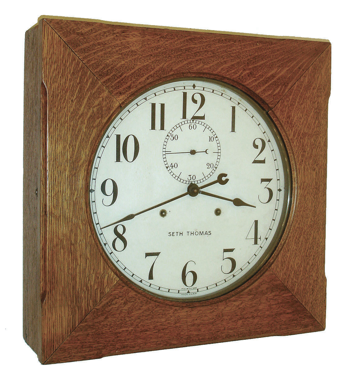 Seth Thomas Clock Co., Thomaston, Conn., "Office No. 11" wall clock with a 30 day time only, movement (no. 86T) in an oak case with a painted metal dial. c 1921 — Antique Clocks Price Guide