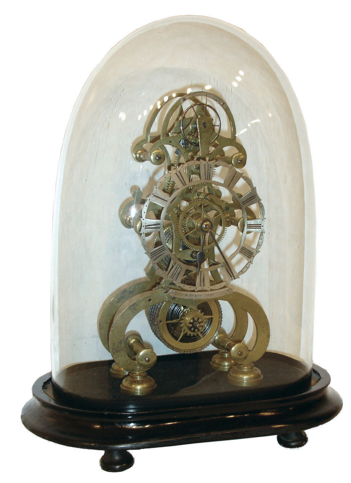 E. Fisher, Bath, England, skeleton clock, the pierced brass frames well proportioned and finished, fusee movement with jeweled lever escapement and balance wheel oscillating above the Roman numeral pierced silvered dial, with plate engraved "E. Fisher Bath" at 6:00, steel spade and poker hands, mounted to an ebonized wooden base, and under a glass dome — Antique Clocks Price Guide