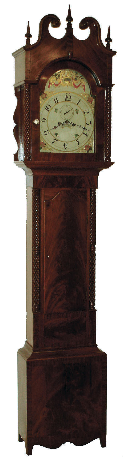 Tall clock attributed to Isaac Brokaw, Bridgetown &amp; Elizabethtown, New Jersey. 8 days, time and strike, on bell, weight driven brass movement in a mahogany veneer case with high arch top, barley twist full columns flanking hood and barley twist and cross hatched 3/4 columns flanking trunk on a base with finely shaped skirt and straight feet. The American made painted metal dial has calendar date aperture, Arabic numerals and subsidiary and fruit motif, c1825 — Antique Clocks Price Guide