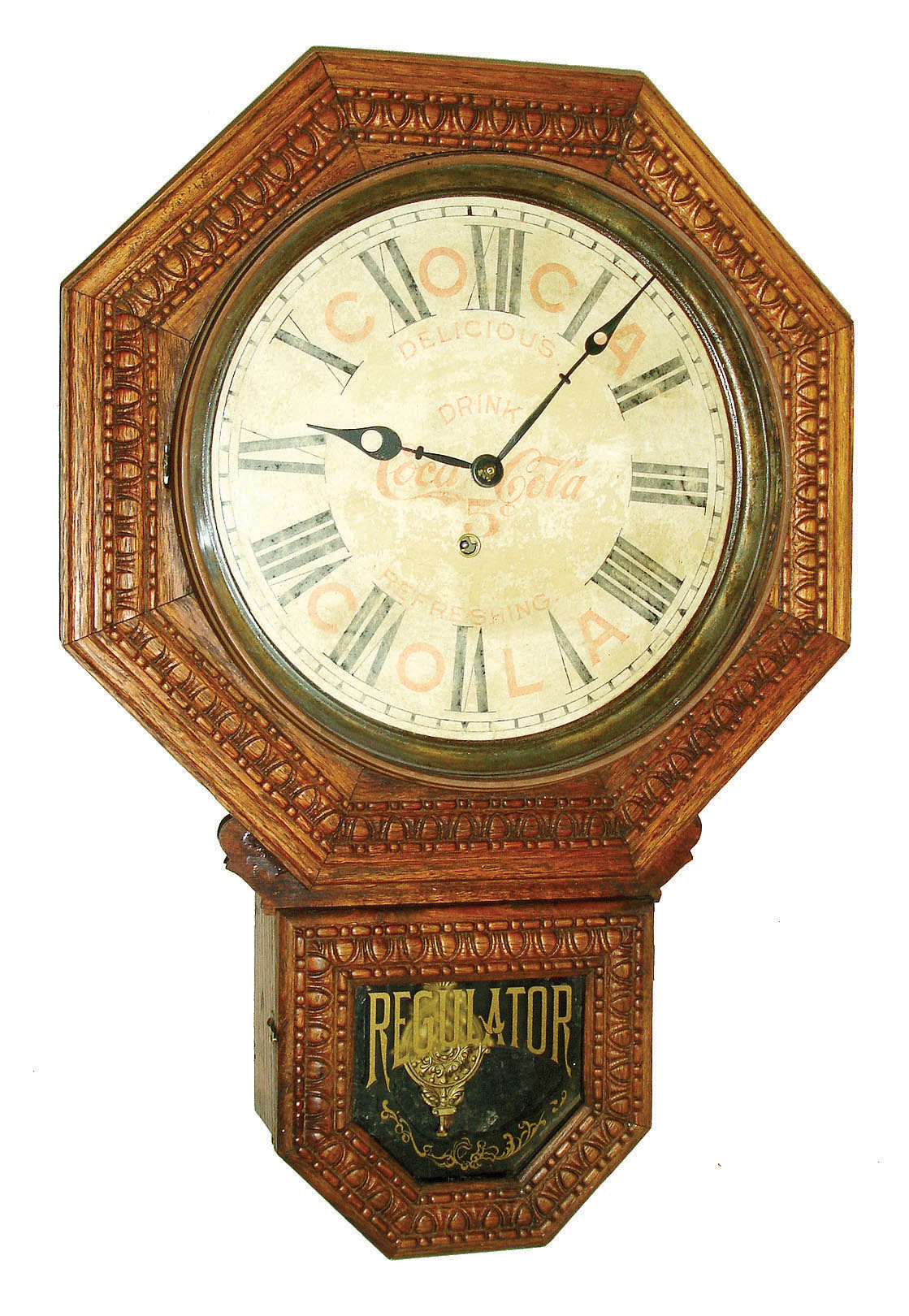 The E. Ingraham Co., Bristol, Conn."12" Drop Octagon" model 8 days,Time only wall clock in solid oak case with Coca Cola advertising dial; c1911 — Antique Clocks Price Guide