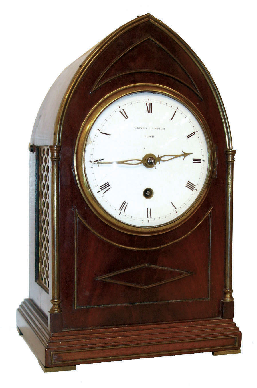 Vigne &amp; Lautier, Bath, England, small bracket clock, lance arch mahogany and mahogany veneer case, with inlaid brass moldings, brass columns and trim, and thin brass feet, the sides with fabric lined pierced brass frets, the back with glazed door, Roman numeral white enamel convex dial, pierced arrow hands, signed brass 8 day fusee timepiece, the shouldered back plate with engraved border, c1835 — Antique Clocks Price Guide