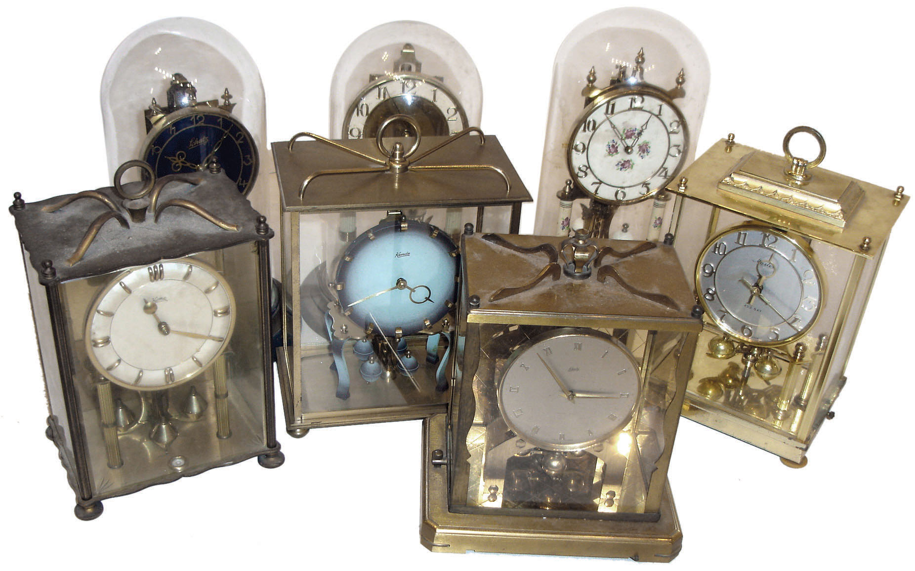 Clocks- 7 (Seven) German 400 day anniversary brass and glass mantel clocks: includes Kundo, Schatz, and Coma in round dome and square case styles, 20th century — Antique Clocks Price Guide