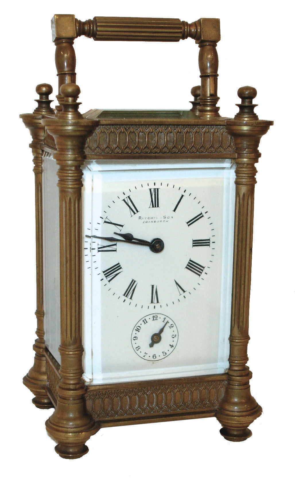 France, for Ritchie &amp; Son, Edinburgh, Scotland, 8 day carriage timepiece with alarm, the bell concealed in the base, gilt brass case with turret corners and turned finials, and with pierced Gothic fret, Arabic numeral white enamel dial, blued steel hands, and with leather covered travel case, c1890 — Antique Clocks Price Guide