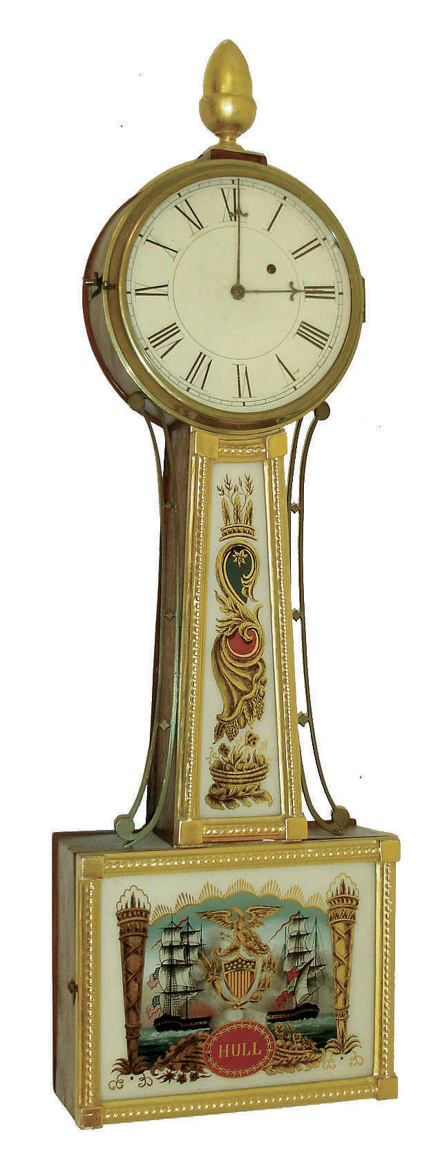 New England banjo clock, mahogany case with gilt frames, reverse painted tablets and gilt finial, Roman numeral white painted sheet iron dial, steel barbed hands, brass 8 day timepiece movement with arch cutouts at bottom of plates, movement mounted by a single screw through the case back, c1830 — Antique Clocks Price Guide