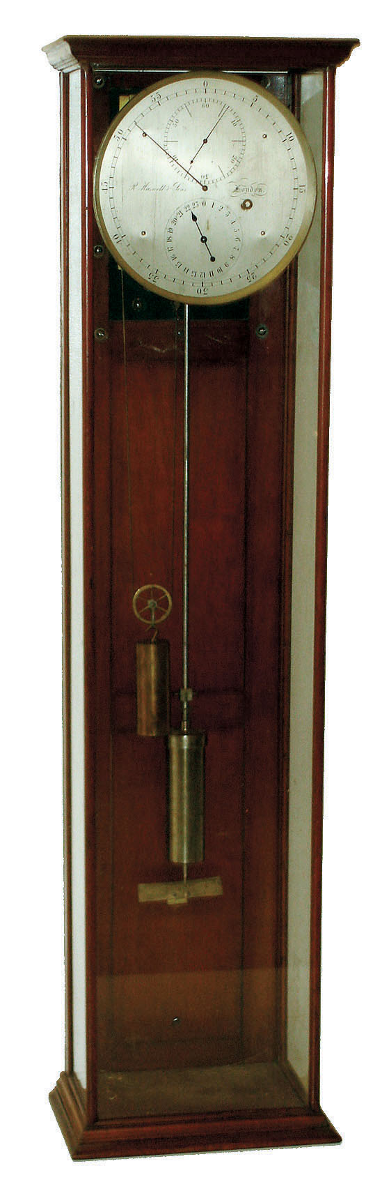 R. Haswell &amp; Sons, London, England, astronomical  regulator, 8 days, time only, weight driven movement, the heavy brass 4 pillar movement  with break circuit mechanism designed to send pulses at one second intervals, Harrisons maintaining power, Graham deadbeat escapement with sapphire jeweled pallets, sapphire jeweled pallet arbor, escape wheel, and third wheel, all with endstones, the remaining mobiles with blued steel end pieces fusee type winding stop, crutch with fine beat adjustment, and compensated mercury pendulum, silvered astronomical dial, signed "R. Haswell &amp; Sons, London, blued steel hands, and contained in a mahogany and glass display case with three glazed panels, the back now with added board with mounting brackets for the movement and pendulum, c1890 — Antique Clocks Price Guide