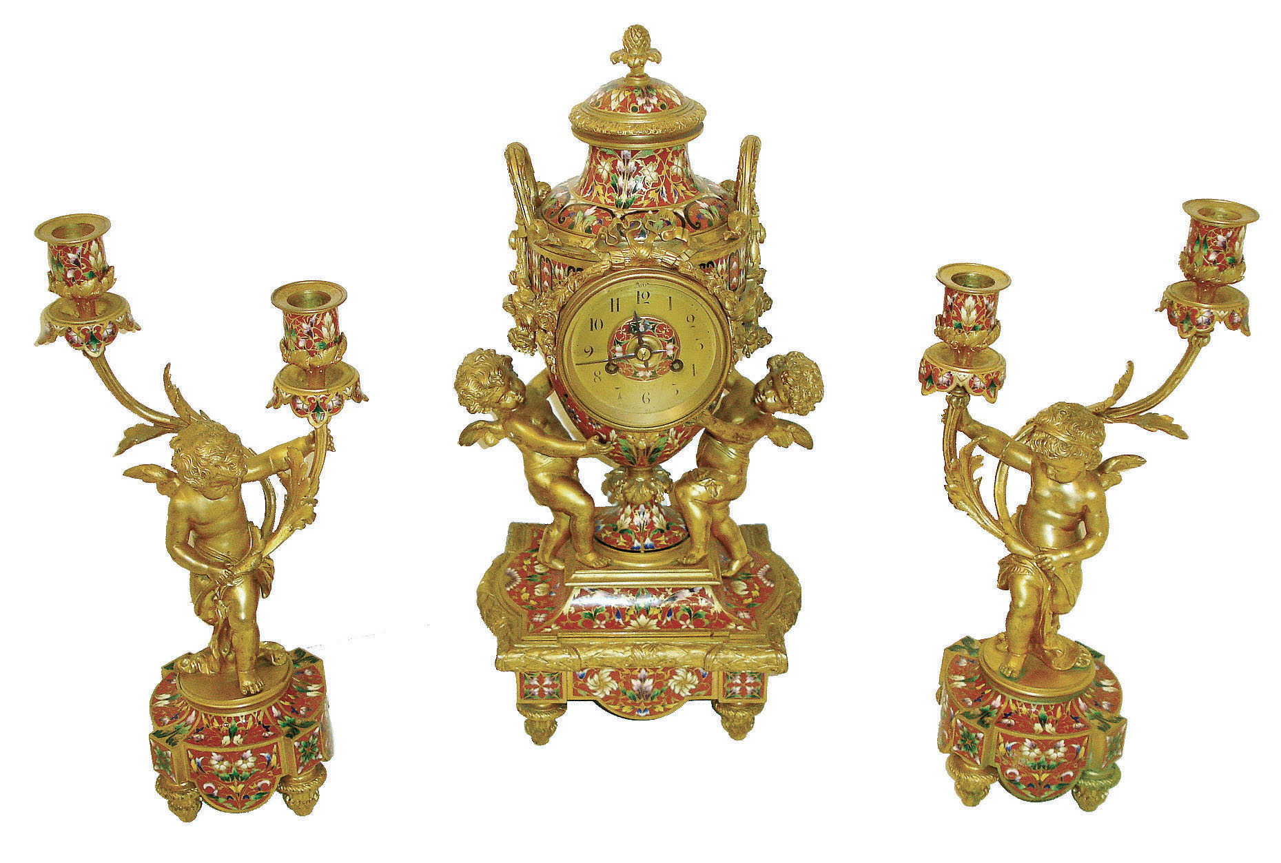 France, for Tiffany &amp; Co., New York, a spectacular 3 piece mantel garniture, the case of urn form supported by two gilt putti, base with foliate decorated toupie feet, and with bound laurel molding, a cast gilt bowknot above dial with suspended floral garlands, and richly ornamented  with very colorful champleve enamel, Arabic numeral gilt dial with champleve center, signed "Tiffany &amp; Co. New York", blued steel hands, brass 8 days, time and strike, movement with lever platform, and also signed "Tiffany &amp; Co. New York", and with a pair of two light candelabra each with a gilt putti, the candle arms with acanthus leaf ornament, and with enamel and feet matching the clock case, c1890 — Antique Clocks Price Guide