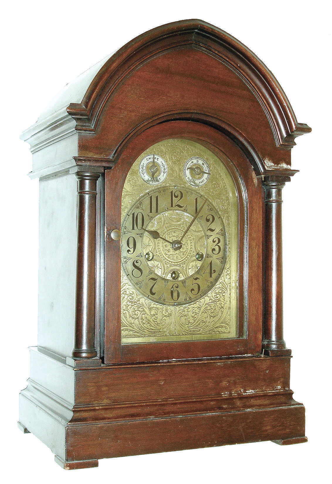 Germany, chiming mantel clock, mahogany case with turned columns, stepped, molded base, and molded, lancet arch cornice, engraved brass dial with Arabic numeral silvered chapter ring, chime/ silent indicator and regulator, blued steel hands, brass 8 day quarter chiming movement, playing Westminster on rods, and marked "Made in Wurttemberg", c1900 — Antique Clocks Price Guide