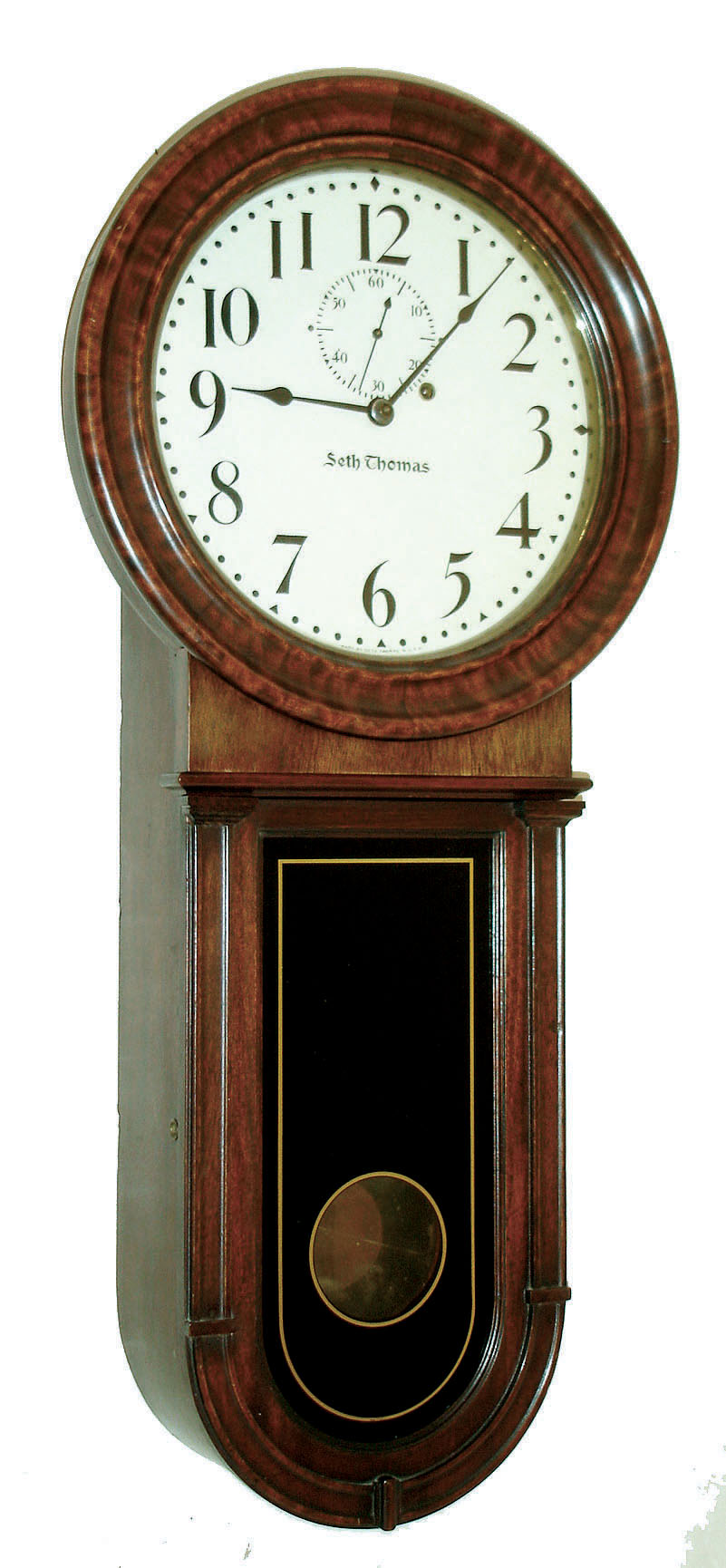 Seth Thomas Clock Co., Thomaston, Conn., "Regulator No. 1 Keyhole" wall clock, 8 days, time only, brass weight driven movement in a mahogany case with painted metal dial and reverse painted tablet, c1915 — Antique Clocks Price Guide