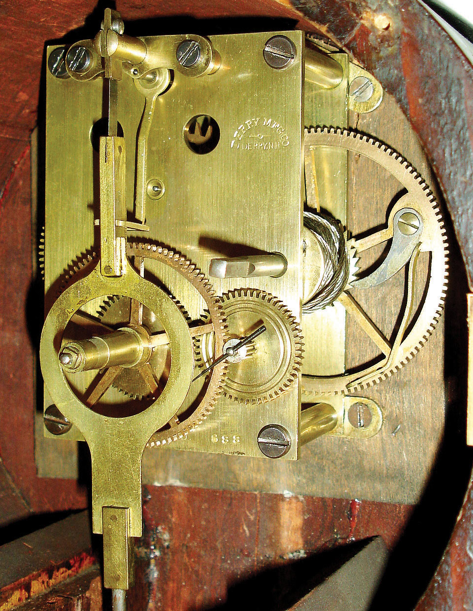 Herschede Clock Co., Cincinnati, Ohio, 8 days, brass weight driven patent or banjo timepiece with a movement supplied by the Derry Mfg Co., Derry, NH c1912. Herschede purchased Derry Mfg Co. tools and equipment and shipped it to Cincinnati in 1912. — Antique Clocks Price Guide