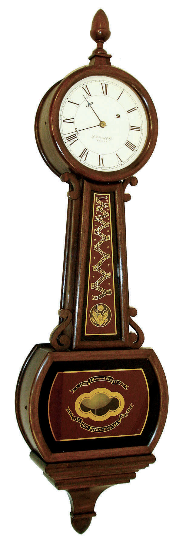 E. Howard &amp; Co., Boston, Mass., "Bicentennial Banjo", wall clock, 8 days, time only, weight driven movement in a mahogany case with reverse painted throat and lower tablets with 13 colonies motif and painted metal dial. 1976 — Antique Clocks Price Guide