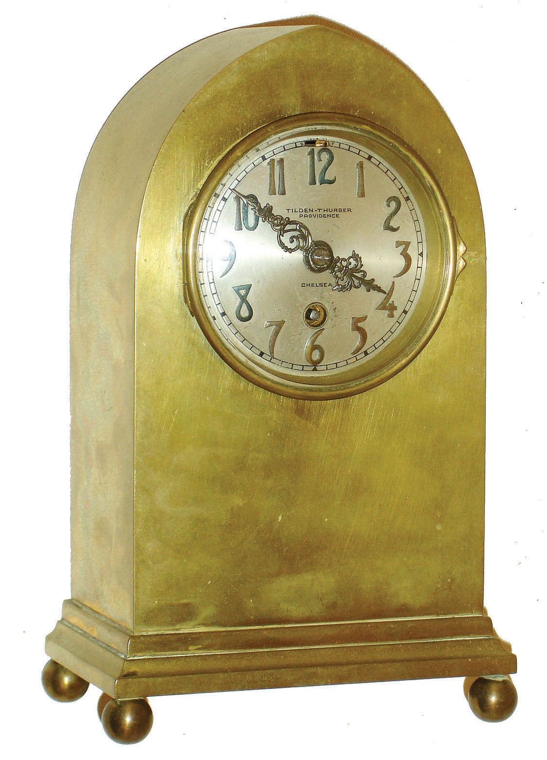 Chelsea Clock Co., Boston, for Tilden-Thurber, Providence, Rhode Island, "Gothic" cast brass 8 day small mantel timepiece (only) with balance escapement, 3" dial with applied bronze numbers, #53555, 1910 — Antique Clocks Price Guide