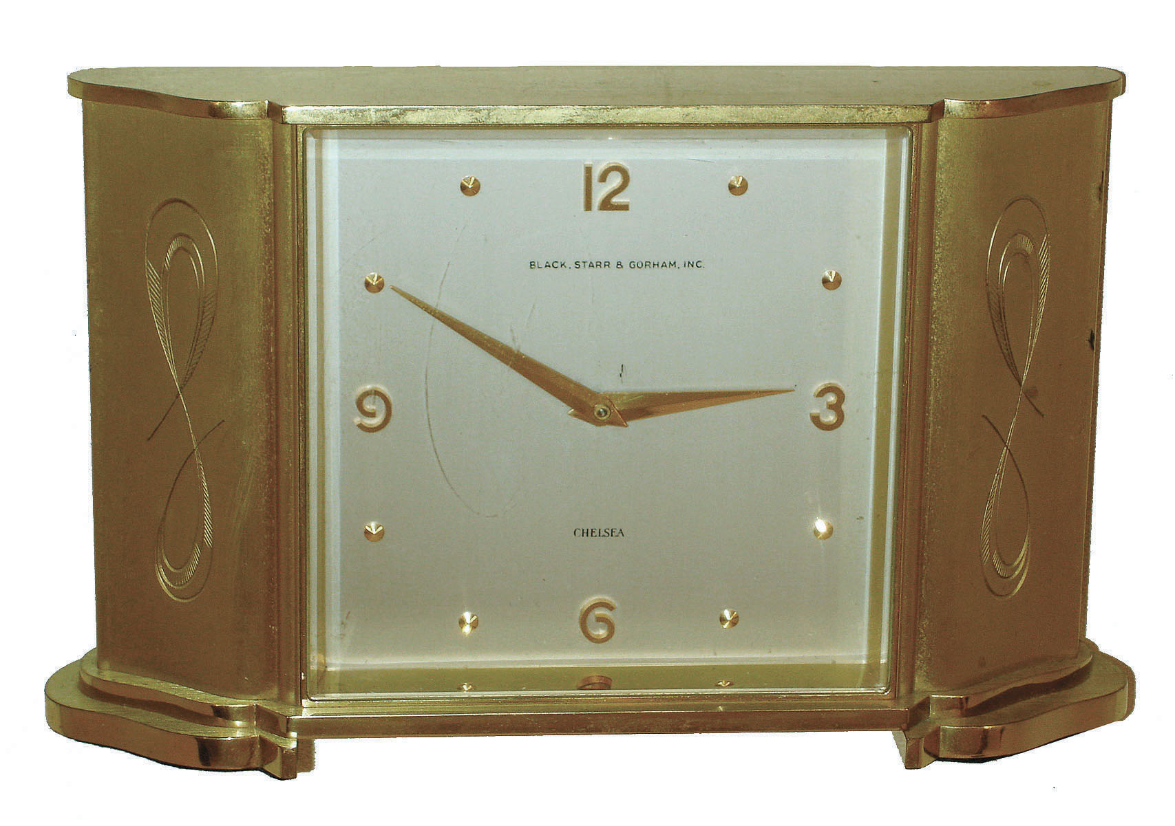 Chelsea Clock Co., Boston, for Black, Starr &amp; Gorham, Inc., "Wisteria" model gold-plated brass 8 day desk clock, c1960. — Antique Clocks Price Guide
