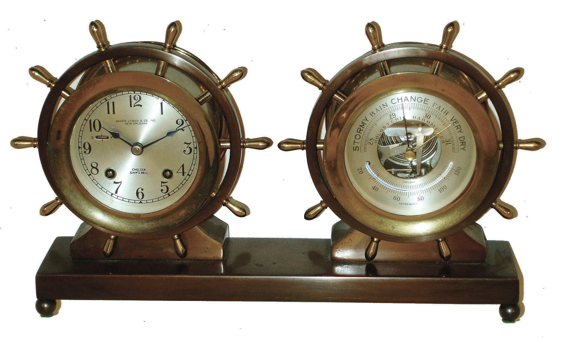 Chelsea Clock Co., Boston, for Baker, Lyman &amp; Co., Inc., New Orleans, "Claremont" bronze and brass 8 day ship's bell striking clock and barometer/thermometer set with yacht wheel handles, #717516, c1967. — Antique Clocks Price Guide
