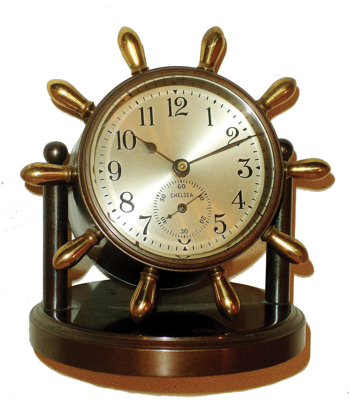 Chelsea Clock Co., Boston, "Clinton" model 8 day time only, desk clock in bronze tilting case with brass yacht wheel handles, c1930 — Antique Clocks Price Guide