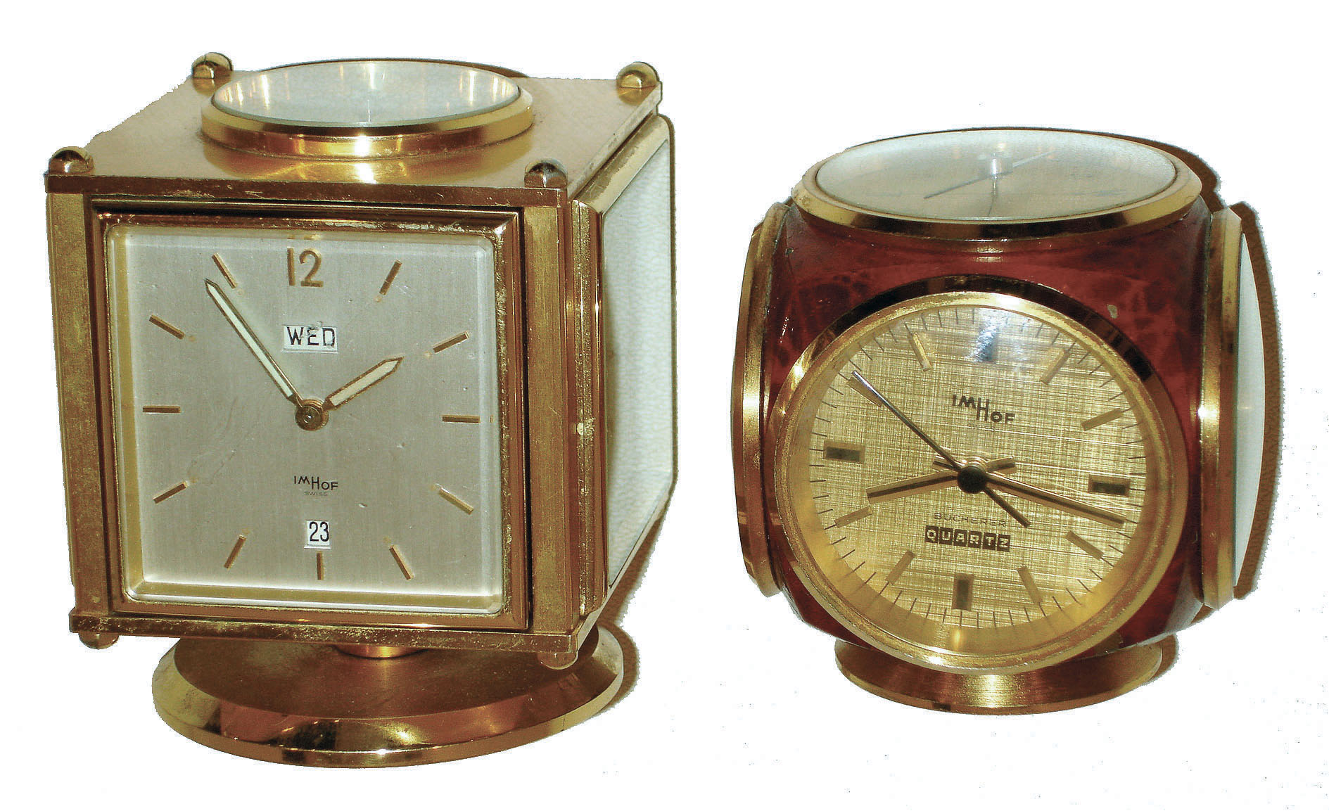 Clocks- 2 (Two): Imhof, Swiss-made swiveling case weather stations with top compass, clock, thermometer, barometer and hygrometer; one square brass with 8 day alarm and calendar clock; one red painted brass with Bucherer quartz clock; later 20th century — Antique Clocks Price Guide