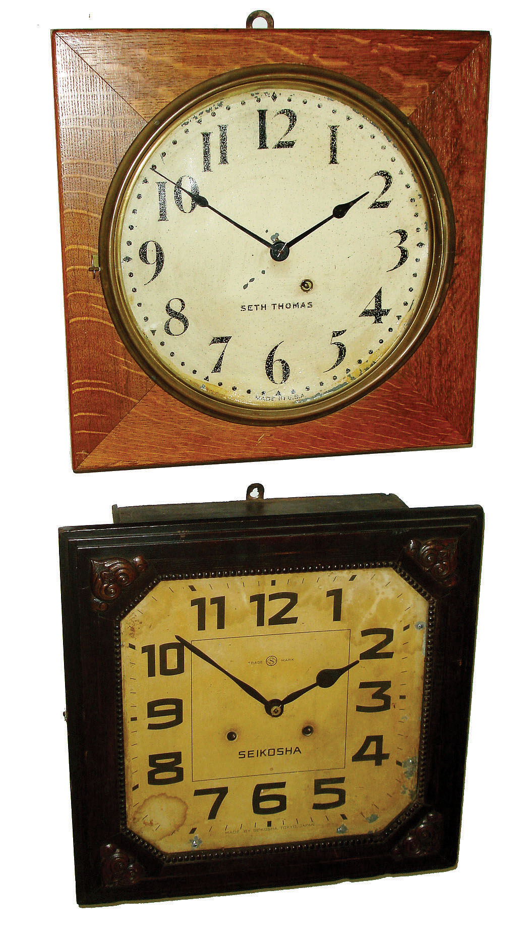 Clocks- 5 (Five) wall clocks: Howard Miller World Time oak case plug-in electric; Telechron bronzed metal case plug-in electric: Seth Thomas square oak case mechanical 8 day time-only; Seikosha square wood 8 days, time and strike,; Waterbury 8" dial Oak octagonal case with time only, lever movement. — Antique Clocks Price Guide