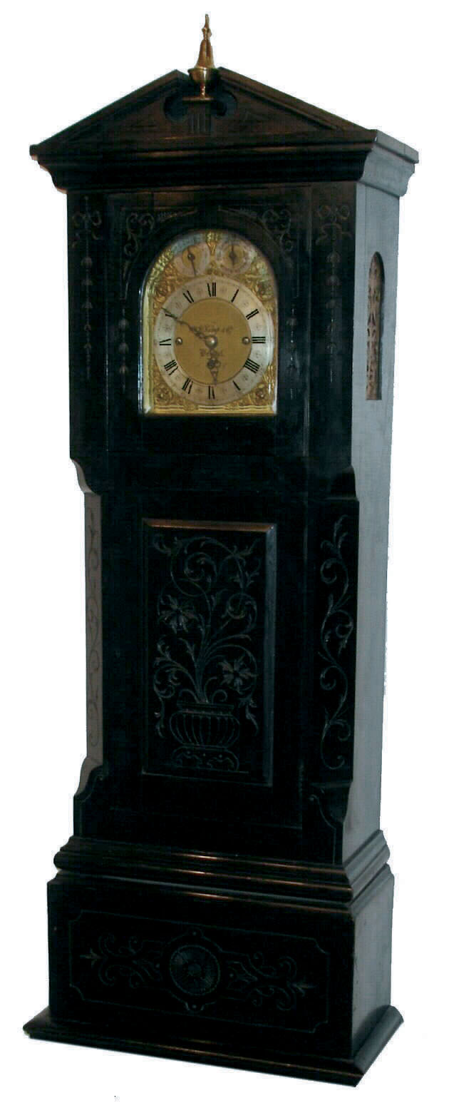 W. W. Kemp &amp; Co., Bristol, England, dwarf tall clock, triple fusee movement, quarter chiming on choice of 8-bells or 5 tubular bells, now in a well constructed case of the same period, with hand carved decorations, c1910 — Antique Clocks Price Guide