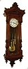 Clocks- 2 (Two): (1) F. Primoda, in Wien, Vienna regulator, walnut and walnut veneered case, split turned columns with carved capitals and bases, deeply curved veneered bottom bracket with inlay, removable carved crest above a molded cornice, signed Roman numeral white enamel dial, pierced blued steel hands, brass 3 train 8 day movement with grand sonnerie striking, ticks and strikes, c1880, and (2) Vienna regulator, ebonized case with turret corners and fluted ornaments, deeply molded door and S curved bottom bracket, Roman numeral white enamel dial, pierced blued steel hands, brass 8 day timepiece movement, polished brass pendulum and weight, c 1870