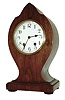 New Haven Clock Co., New Haven, Conn., unidentified model cabinet clock with 8 days, time and strike, (cathedral gong) movement in a mahogany veneered case, c1924.