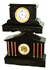 Clocks- 2 (Two) French black marble 8 days, time and strike, mantel clocks: flat top with Etienne Maxant movement with hidden front pull-out winders; 6-column architectural case with A.D. Mougin movement; c1890
