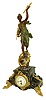 France, figural mantel clock, green variegated marble case on gilt scroll feet with naturalistic ornament and with gilt drops at the sides, and with a patinated female figure representing Victory, with applied plaque engraved "Victoire par Bruchon", dial surround in the rococo style, cast bezel with beveled glass, Arabic numeral white enamel dial, blued steel hands, 8 day pendule a Paris timepiece movement, c1910