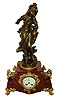 France, figural mantel clock "La Cruche Cassee" or the broken jug, shaped red marble case with gilt paw feet and side ornaments, gilt dial surround, gilt bezel with beveled glass, top with patinated female figure carrying a damaged jug, leaking its contents, the base with engraved plaque "La Cruche Cassee par Francois Moreau", Arabic numeral white enamel dial, blued steel hands, 8 days, time and strike, pendule a Paris movement, c1900