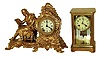 Clocks- 2 (Two) 8 days, time and strike, mantel clocks: Ansonia "Racine" cast metal figural; French brass and beveled glass crystal regulator with Marti movement; c1900