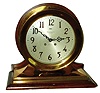 Chelsea Clock Co., Boston, "Commander" 8 1/2" dial 8 day ship's bell striking brass case on mahogany base mantel clock retailed by Spaulding & Co., Chicago, 1908.