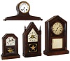 Clocks- 4 (Four) shelf: (1)Jerome & Co., New Haven, Conn., 30 hours, time & alarm mini sharp gothic or steeple timepiece, c1875. (2)Ansonia Clock Co., New York, 8 days, time and strike, tambour, c1915. (3)Atkins Clock Co., Bristol, Conn., 30 hours, octagon top cottage timepiece, c1875. (4)Ansonia Brass & Copper Co., Ansonia, Conn., 8 days, time and strike, mantel clock, c1875.