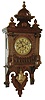 Junghans, Germany, Berlin style Free Swinger, in walnut case with 8 days,single rod striking movement and brass Art Noveau style embossed pendulum, c1910