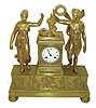 France, large and impressive gilt bronze figural mantel clock, love themed, and replete with classical ornament, with male and female figures flanking the architectural clock case, the winged male representing Cupid and holding a wreath aloft in his right hand, the top of clock case with floral wreaths joined with a bowknot and ornate cornucopia, the base with applied relief castings of Cupid and Psyche, all on large cast feet with engine turned ornament, Roman numeral white enamel dial signed "Joignerey a Paris", and with finely detailed gilt bezel, blued steel Breguet style hands, 8 days, time and strike, pendule a Paris movement with silk thread suspension, bell signed "Beaubier", case with glazed rear cover, c1820