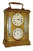 English carriage style small desk case, now married with a Swiss lever movement clock, aneroid barometer below the clock and thermometers for both Fahrenheit and Centigrade, and with a compass in the top of the case, C.1950