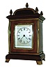 France, a small - miniature desk clock, in the form of an English bracket clock, for the London market, with a good Paris made carriage style platform lever timepiece movement, in a mahogany case with polished brass trim and 5 finials; c1890
