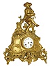 France, spelter or white metal with gilt finish figural clock, and with good pendule a Paris movement, the dial signed Brossier, and the case showing a young boy in knickers playing the bag pipes, c1900