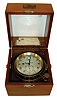 Thomas Mercer, St. Albans, England, two day marine chronometer, decorated brass movement with spring detent escapement and chronometer balance, signed Roman numeral silvered dial with up/ down display, blued steel spade and poker hands, contained in a gimballed brass bowl with spring loaded shutter for access to winding, screw bezel with beveled glass, teakwood interior and exterior protective cases, the inner case with engraved plaque of Alf Lie, watch and chronometer maker and with a small group of service and rate records, serial #23373, c1960