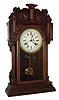 Waterbury Clock Co., Waterbury, Conn., "Niagara" 8 day time, strike & calendar walnut parlor clock, c1911