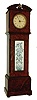 Miniature tall clock, burl walnut veneered case, the trunk with brass framed ceramic panel decorated with a vase and flowers, Arabic numeral painted dial marked "Howell. James & Co. 579 Regent St.", with Imhof 8 day timepiece movement, the clock finial serving as winding crown, c 1910