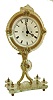 E.G. Zimmerman, Frankfurt, Germany, 30 hours, timepiece movement night clock, the case of transparent glass with cut edge decoration, supported by a polished brass frame and with turned brass feet and decorative finials, candle holder at center of back for dial illumination, Roman numeral translucent glass dial, blued steel hands, the movement barrel bridge marked "E.G. Zimmermann Frankfurt AM", c1880