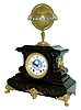 Edouard Serin, Paris, France, mantel clock with moon phase display and surmounted by a terrestrial globe on gilt stand, The black slate case with gilt brass mounts and incised line decoration, gilt bezel with beveled glass, blued steel hands, Roman numeral white enamel dial with central moon phase display, and signed "Decultot Epernay"..  The stand above with equatorial ring mounted with 24 Roman numeral cartouches indicating AM/ PM hours at any point on the earth, globe mounted with a steel pointer indicating the current time in Paris, the opposite side with silver indicator marked "Antipode de Paris", and also with label marked "Edouard Serin Brevete S.G.D.C. Paris", and with his trade mark, 8 days, time and strike, movement which also serves to rotate the globe, square plate movement also with the trade mark of Edouard Serin, c1880