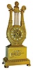 France, 8 days, time and strike, Lyre form shelf clock with pendule a Paris movement with silk suspension, gilt bronze case ornamented in the Grecian style, the base with long horn, wreaths and bowknot, top of lyre with swans heads and central bust, gilt skeletonized dial with anthemion decoration and set with round enamel Arabic numeral cartouches, blued steel Breguet style hands, c1830