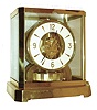 Jaeger - LeCoultre, Switzerland, "Atmos" clock, 15 jewel gilt caliber 528 movement, gilt torsion pendulum, round white painted dial with applied gilt Arabic numerals and arrow markers, gilt hands with black painted tips, all contained in a glazed rectangular case with removable front panel, serial #318165