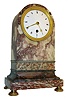 France, 8 days,marble mantel or table timepiece with pendule a Paris timepiece movement with silk thread suspension, the variegated stone case with round top, cavetto molded base and resting on gilt feet, Roman numeral white enamel dial, gilt bezel and hands, c1815