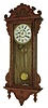 Waterbury Clock Co., Waterbury, Conn.,  "Alton" wall hanging model with 8 days, time and strike, (hour and half hour on cathedral gong) movement in an oak case, c1906.