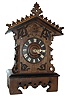 Germany, Black Forest shelf cuckoo, oak and oak veneered case with ebonized moldings, leaf carved roof trim, and applied carved ornament on case front, Roman numeral wooden dial with carved bone hands, brass 8 days, time and strike, movement, the time train with going barrel, and the strike train with fusee, carved, painted wooden bird, c1880