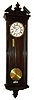 Clocks- 2 (Two) wall clocks: Tan Liong Tik, Soerabaya, 8 days, time and strike, stained wood R/A wall clock; German(?) 8 day one weight Vienna regulator in faux rosewood grained wood case.