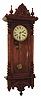 Waterbury Clock Co., Waterbury, Conn., "Grant" wall clock, 8 days, time and strike, spring driven movement in an oak case with papered metal dial, c1920