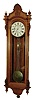 Seth Thomas Clock Co., Thomaston, Conn., "Regulator No. 16" wall clock, 8 days, time only, brass weight driven movement earlier version mounted on the standard No. 3 bracket with center sweep seconds in a walnut case with black walnut back panel and burled highlights and painted metal dial, c1884