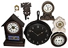 Clocks- 7 (Seven): six mechanical wall and mantel clocks, plus a 16" diameter metal frying pan clock with battery movement, early 20th century